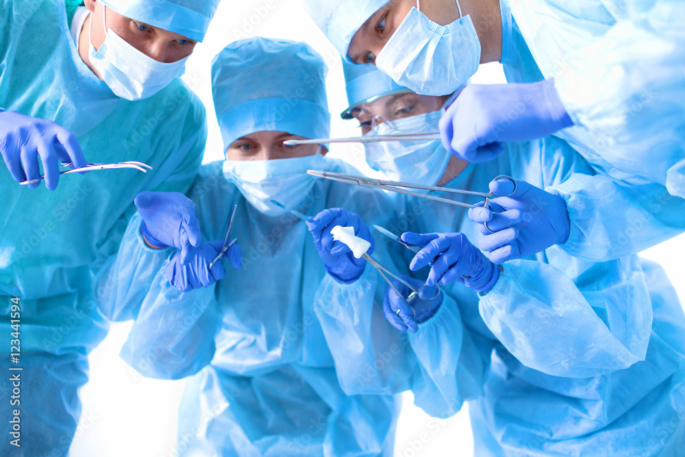 Team of surgeon in uniform perform operation on a patient at cardiac