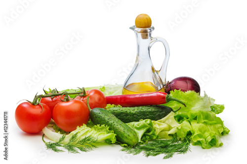 Set vegetable and jug of vegetable oil isolated on the white bac