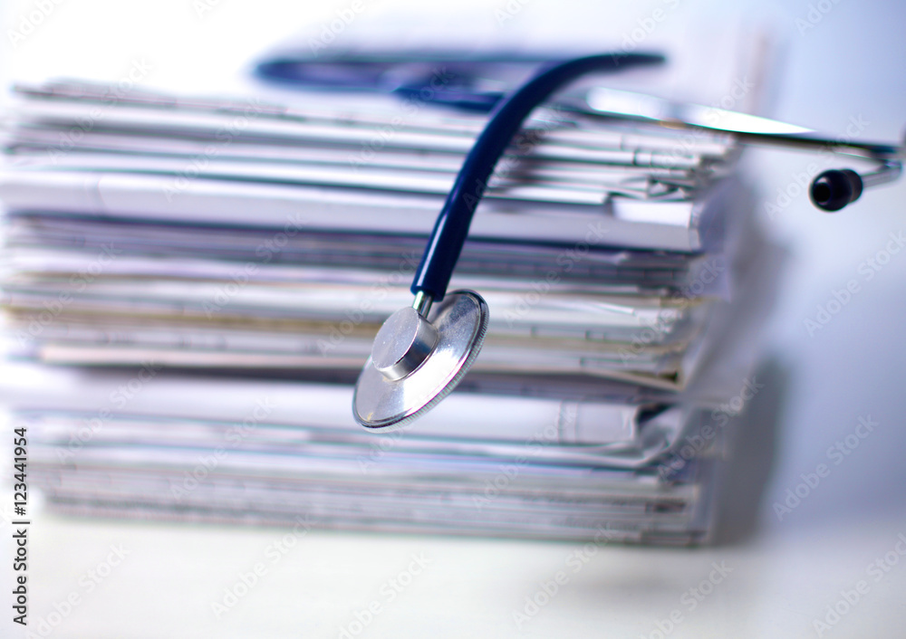 books folder file and stethoscope isolated on white background