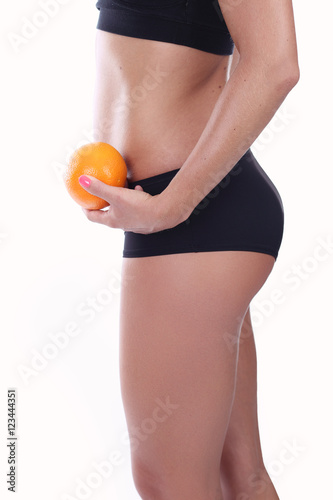 Fruit diet - girl holding an orange