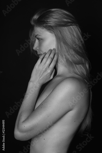 Black and white studio photo of elegant naked lady
