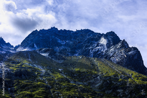 dramatic picture with mountain peak in alps