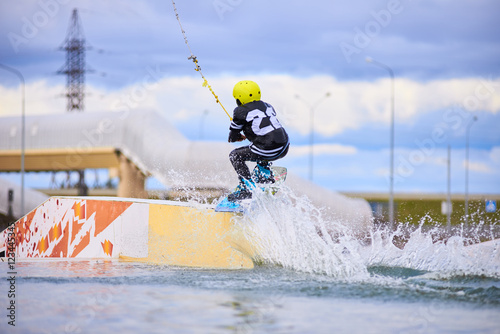 Happy rider start ride session in wakepark. School of extreme riding. Sport concept.