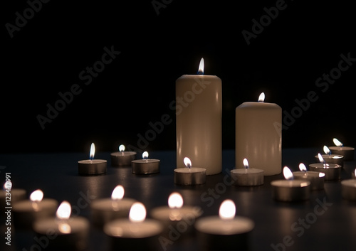 Candle lights, Christmas candles burning at night. Abstract candles background. 