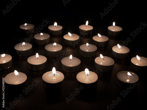 Candles light, Christmas candles burning at night. Abstract candles background. 