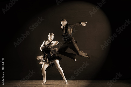 dancers in ballroom isolated on black background © konstantant