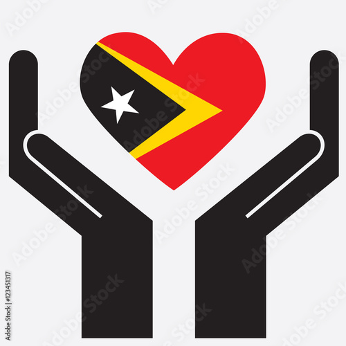 Hand showing East Timor flag in a heart shape. Vector illustration.  photo