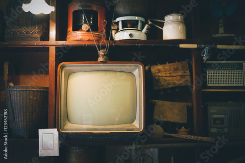 Retro television in cover wood in front wall