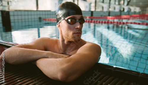 Professional male swimmer resting