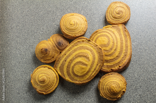 homemade cookies spiral with beads on a grey background