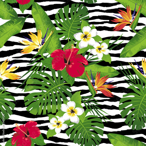Tropical flowers and leaves on zebra background. Seamless. Animal Print Fashion.