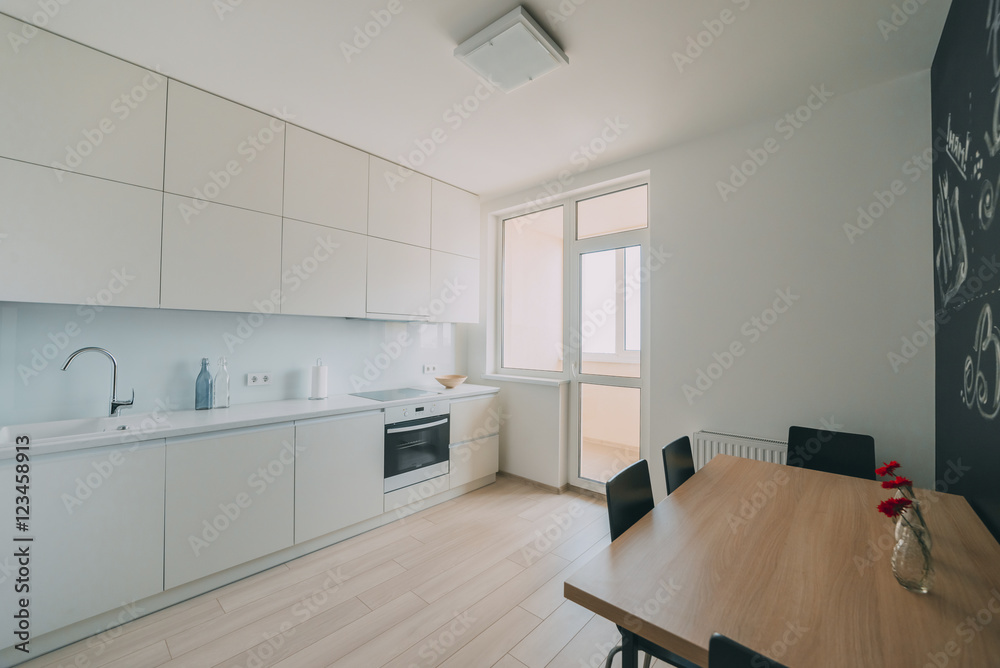 Light interior with flooring in a modern apartment Light interior with flooring in a modern apartment