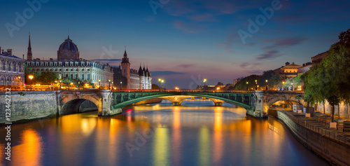 Paris Panorama. Panoramic image of Paris riverside during twilight blue hour.