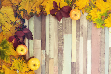 Striped background with leaves, apples