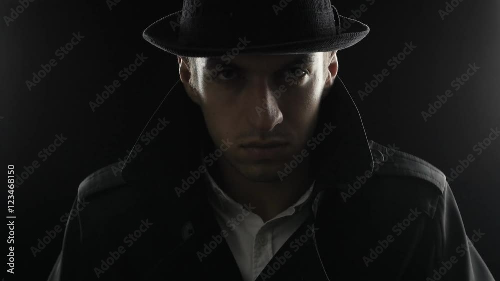 Portrait of a gangster in a hat and a black cloak Portrait of a gangster in a hat and a black cloak