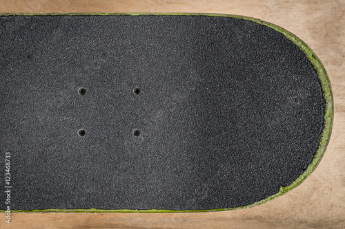 top view of a skateboard and griptape in skatepark
