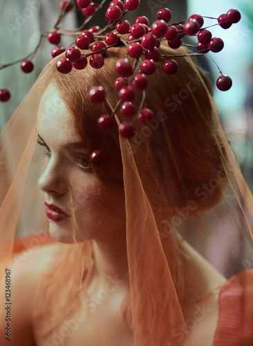 Portrait of young woman wearing veil with plant decoration