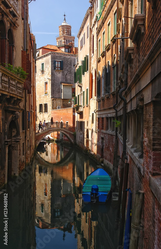 Scenic view of venetian canal with boat, Venice, Italy
