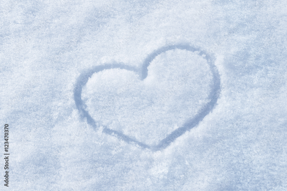 The shape of heart painted on the snow