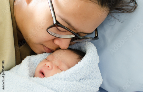 Asian mother with newborn baby in the hospital