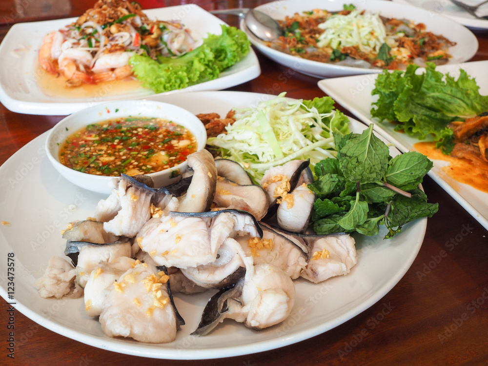 Dip fish fillets poached with seafood sauce. Dip fish fillets poached with seafood sauce.
