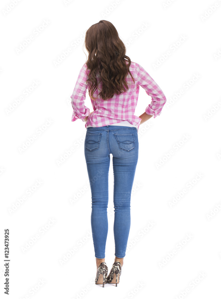 Young beautiful brunette woman in blue jeans