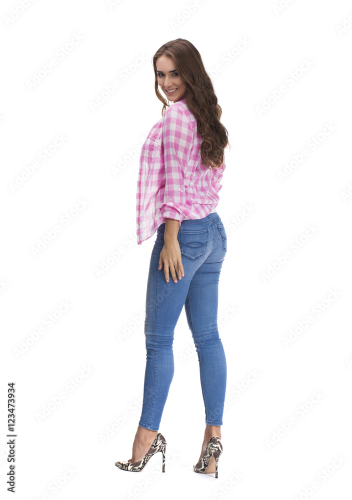 Young beautiful brunette woman in blue jeans Young beautiful brunette woman in blue jeans