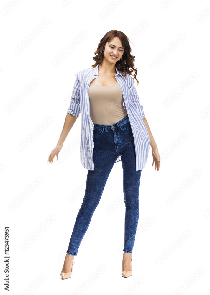 Young beautiful brunette woman in blue jeans
