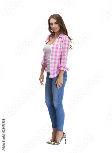 Young beautiful brunette woman in blue jeans