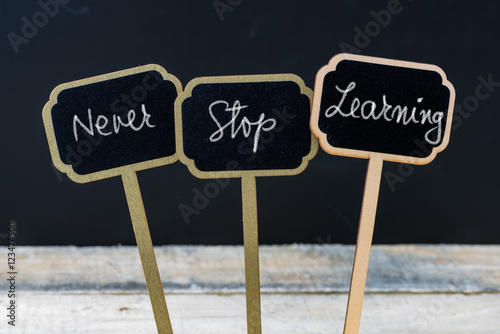 Motivational message Never Stop Learning written with chalk