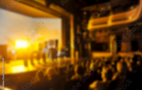 Audience in a theater, on a concert and applauding blurred