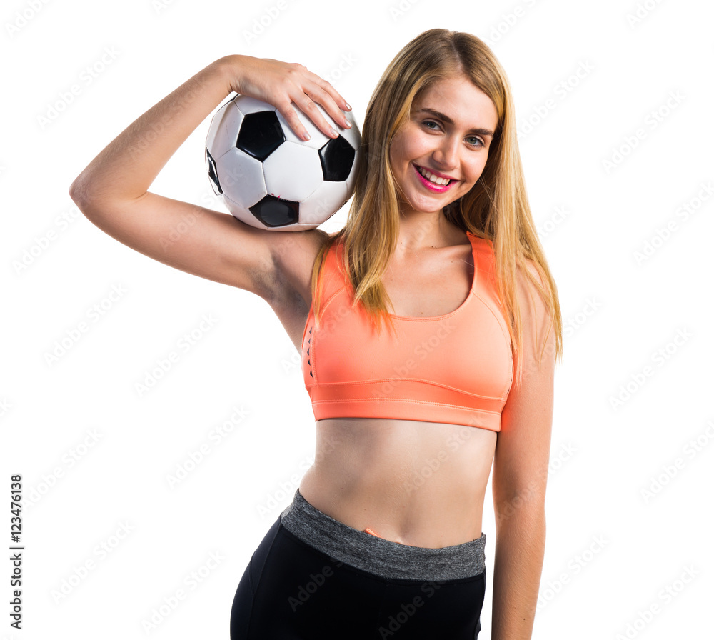 Pretty blonde girl holding a soccer ball Pretty blonde girl holding a soccer ball