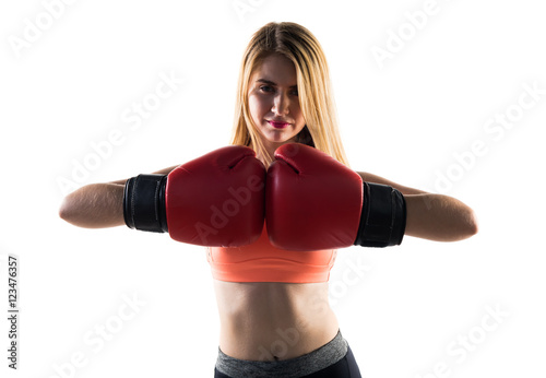 Blonde girl with boxing gloves © luismolinero