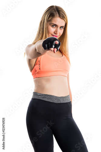 Sport woman pointing to the front © luismolinero