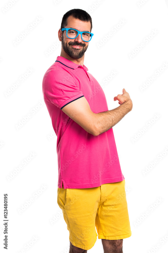Fototapeta premium Man with colorful clothes pointing back