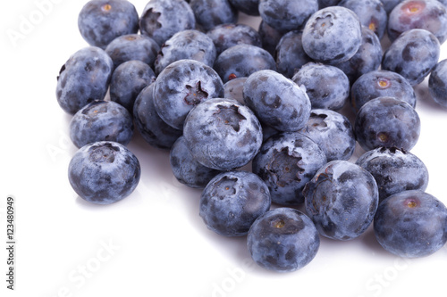 close up of blueberries on white background