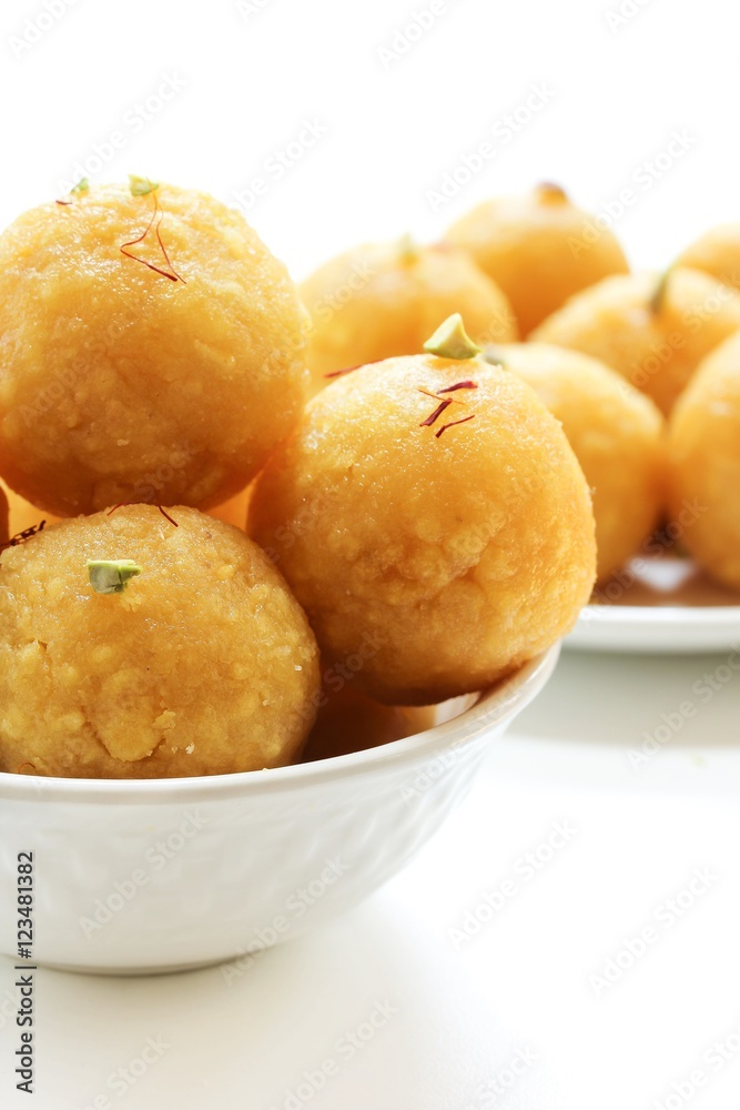 Indian Sweet Motichoor ladoo or laddu on white background, selective focus