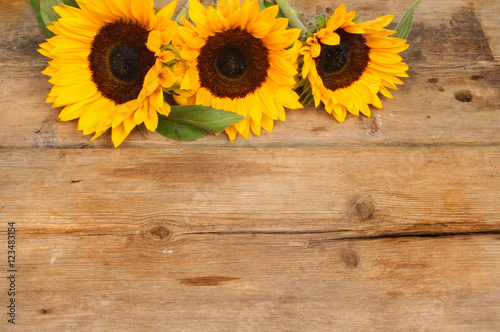 Sunflowers on rustic wood