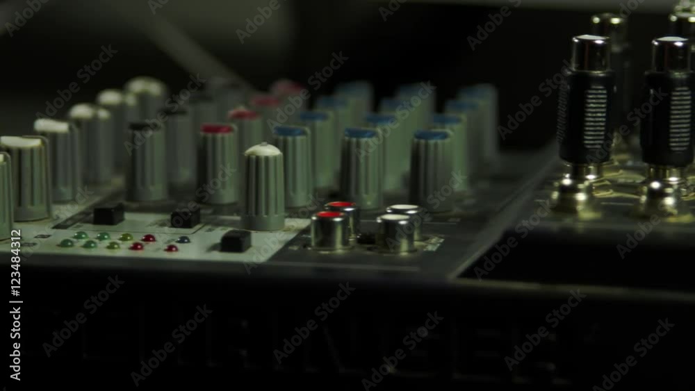 Editor's Hand Inserting Headphones Jack Into Sound Mixer, Media, Equipment, Pan Editor's Hand Inserting Headphones Jack Into Sound Mixer, Media, Equipment, Pan