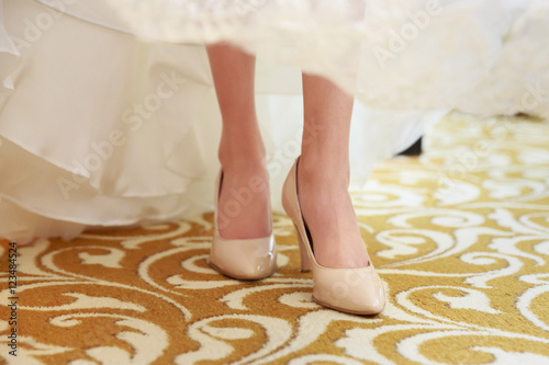 bride wearing her high heels shoes on wedding day