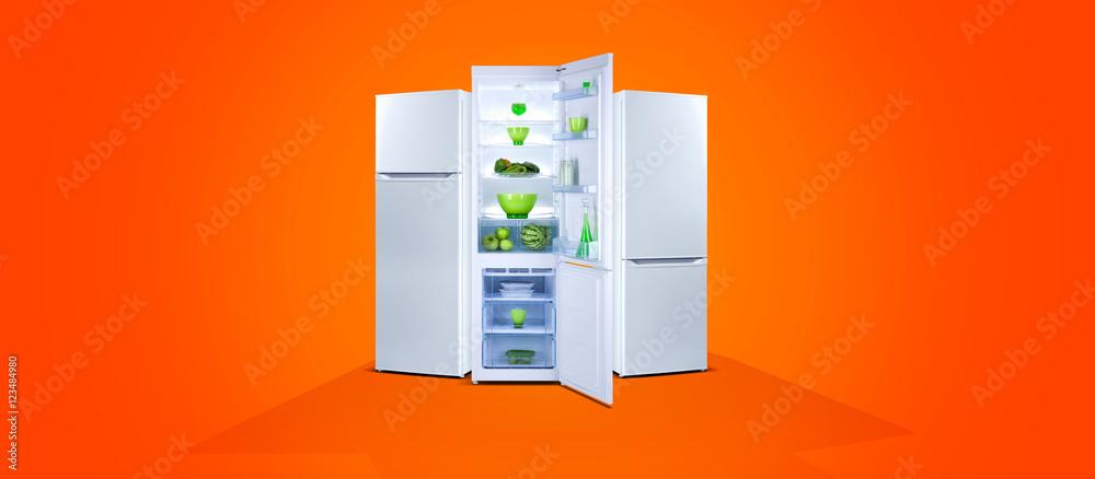 Three refrigerators with fresh food, open door, white steel, orange background Three refrigerators with fresh food, open door, white steel, orange background