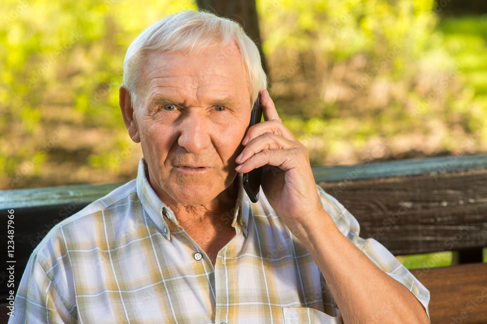 Senior man with phone. Surprised face of old guy. I finally heard the truth. Uncovering the secret. Senior man with phone. Surprised face of old guy. I finally heard the truth. Uncovering the secret.