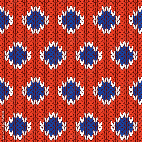 Knitting seamless pattern in blue, white and orange colors