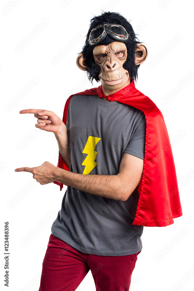Superhero monkey man pointing to the lateral