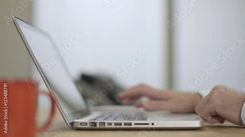 Businessman closes laptop and finishes work