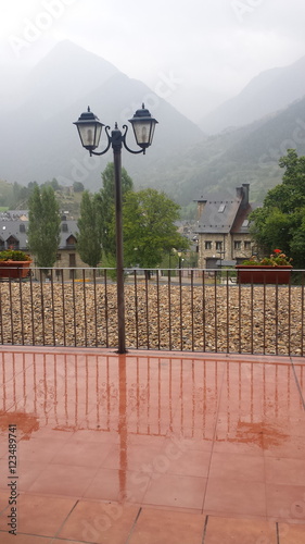 Reflection of a lamp on the wet floor in a rainy day