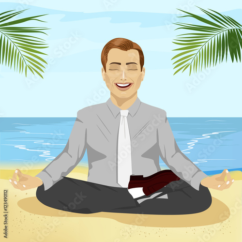 young smiling businessman doing yoga on tropical beach