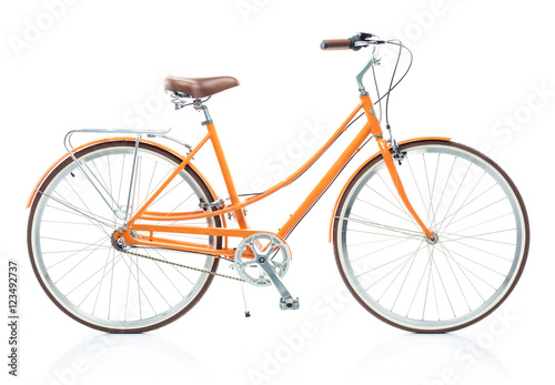 Stylish womens orange bicycle isolated on white © vladstar