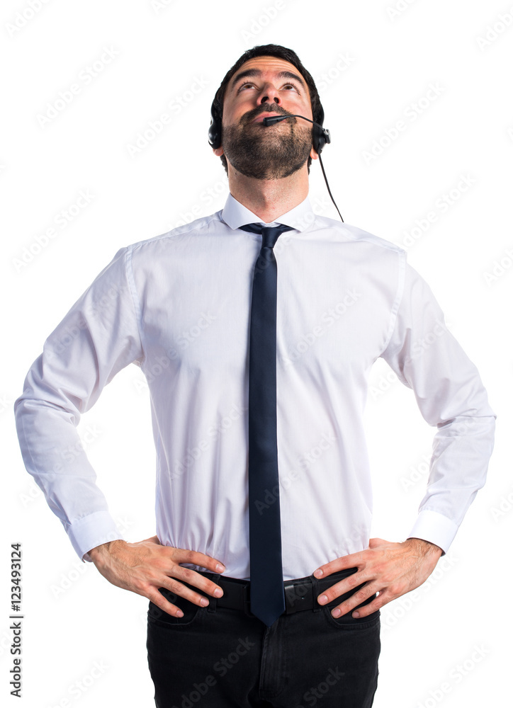 Young man with a headset looking up Young man with a headset looking up