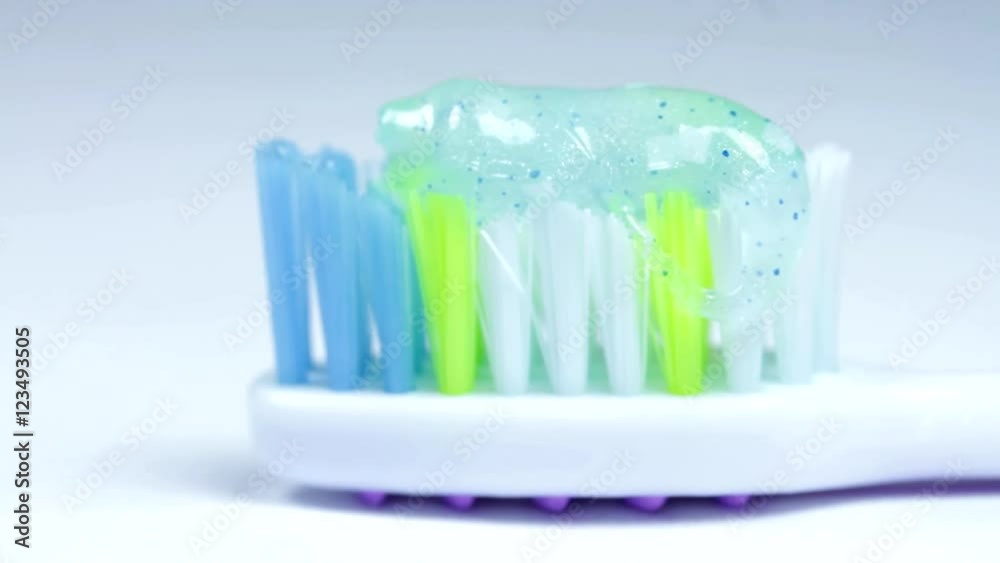 Toothbrush With Toothpaste Isolated On White, Oral Hygiene, Macro Shot, Pan Toothbrush With Toothpaste Isolated On White, Oral Hygiene, Macro Shot, Pan